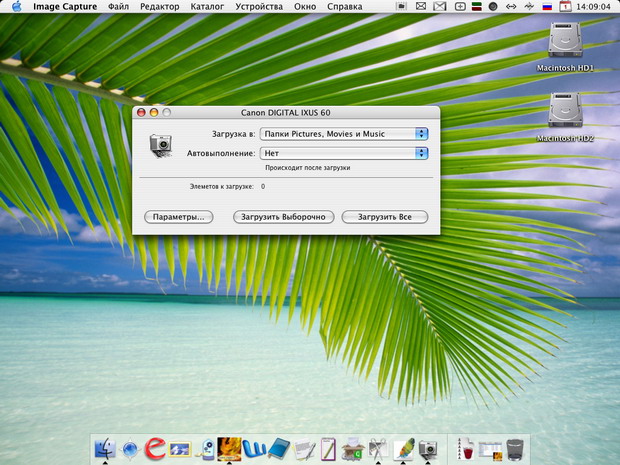 Цифровой фотоаппарат подключен к компьютеру Макинтош с операционной системой Mac OSX